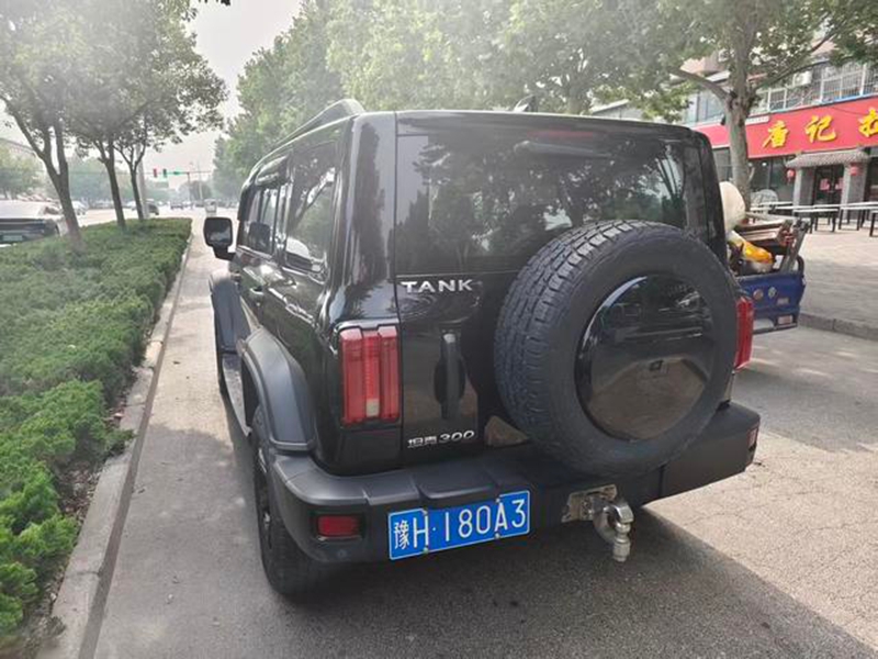 Representative black used GWM Tank 300 rear three-quarter view with external spare wheel